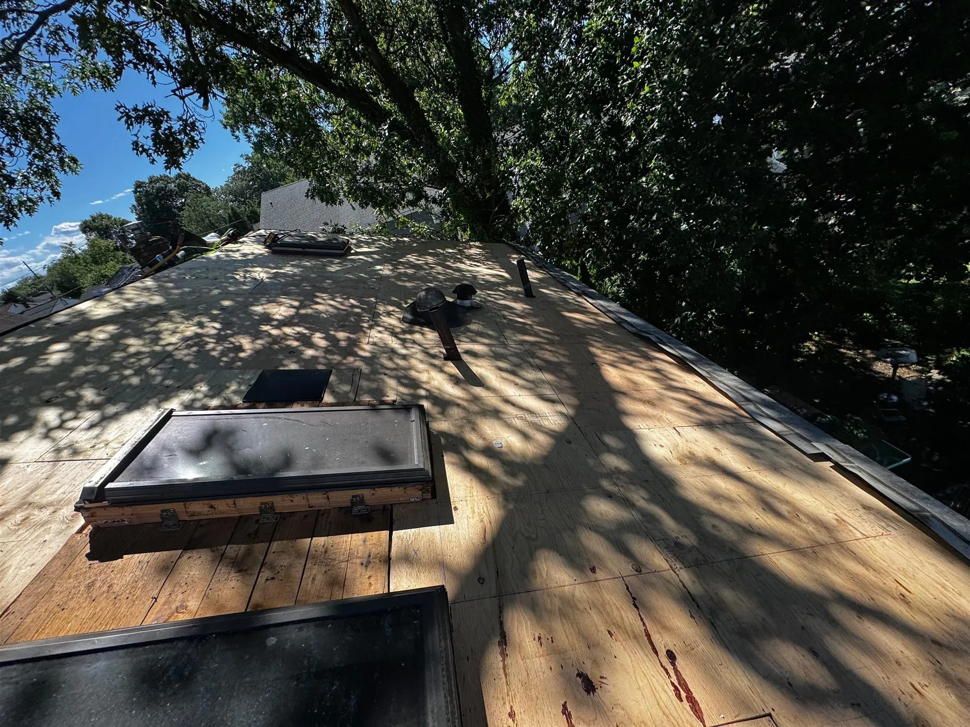 Plywood roof deck with a skylight opening