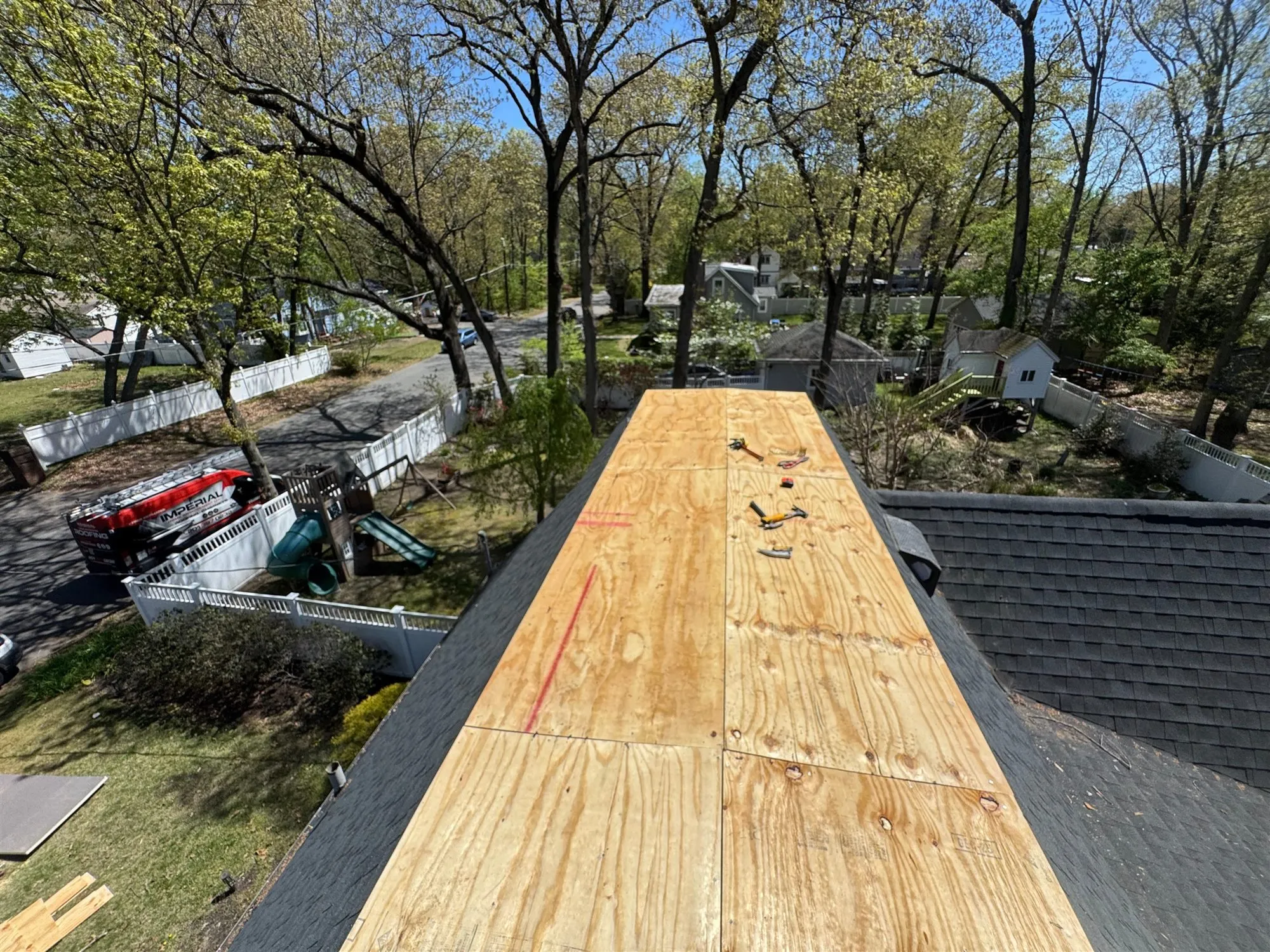New plywood deck on a low-slope roof section