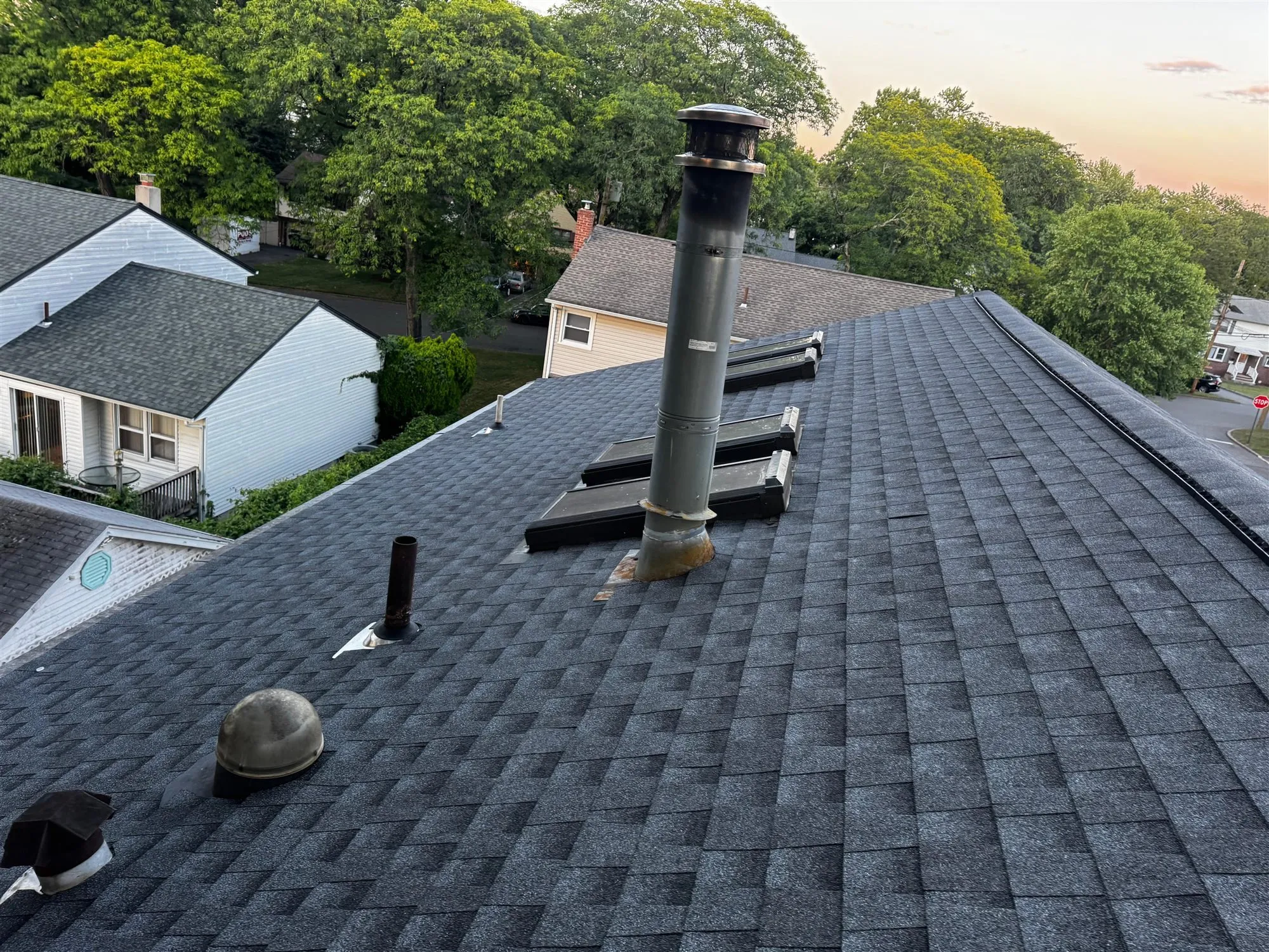Shingle roof with new pipe boots and vents