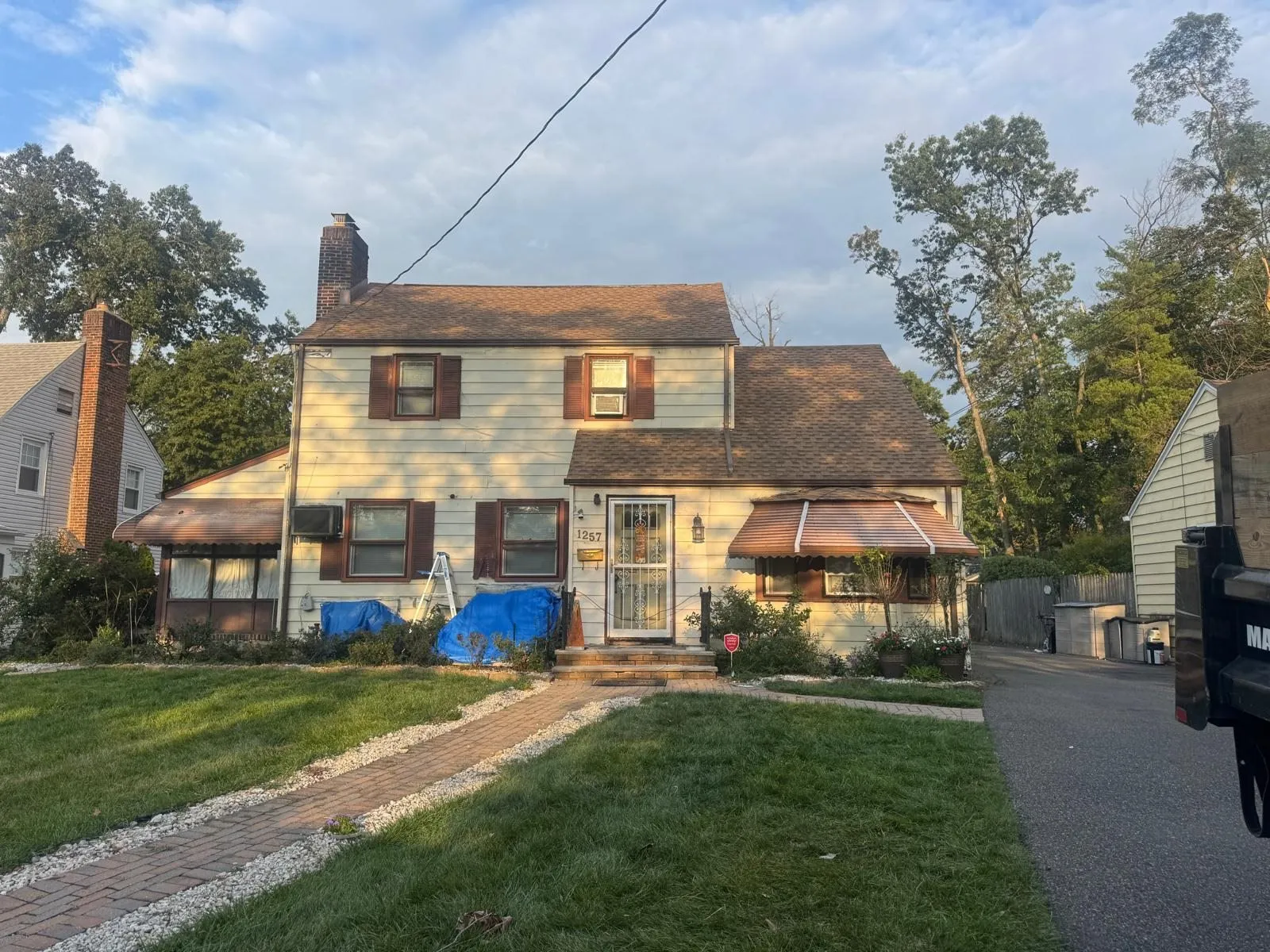 Two-story colonial with a new roof system