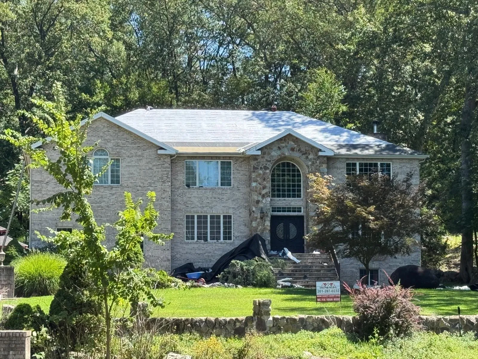 Brick-front split-level home with a new GAF shingle roof